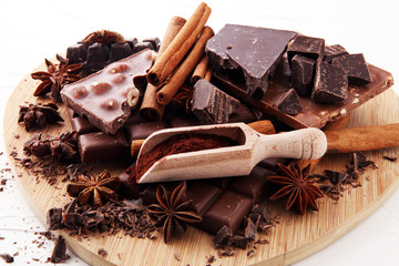 chocolate concept with assorted chocolate, powder and spice.