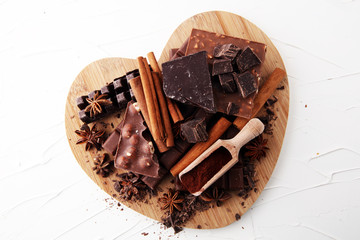 chocolate concept with assorted chocolate, powder and spice.