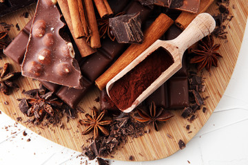 chocolate concept with assorted chocolate, powder and spice.