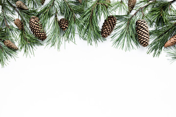 Christmas composition with frame of fir branches and pine cones. Flat lay, top view