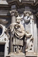 Fototapeta na wymiar View of statues at at Cathedral of Sant Agata in Catania / Italy. It is prominent baroque cathedral known for its columned facade, domed roof, frescoes & paintings.
