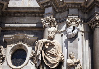 Fototapeta na wymiar View of statues at at Cathedral of Sant Agata in Catania / Italy. It is prominent baroque cathedral known for its columned facade, domed roof, frescoes & paintings.
