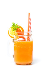 Carrot smoothie in a jar isolated