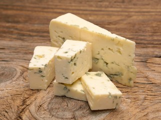  moldy blue cheese on wooden background