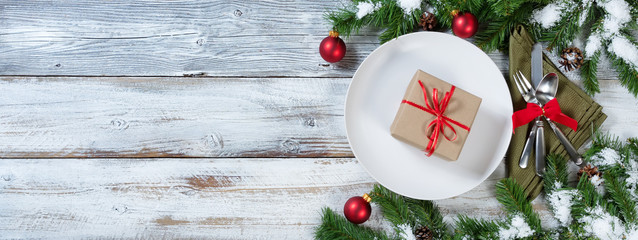 Christmas Table place setting with gift on plate