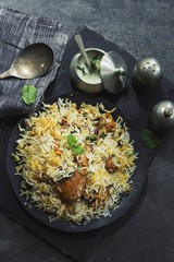 Overhead view of Homemade Chicken Biryani on dark moody background