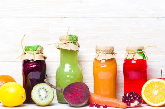 Colorful fresh juices with fruits isolated
