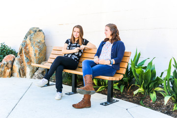 Girls Sitting on Bench together