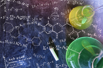 Classroom desk and drawn blackboard of chemistry teaching top view