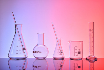 Supply of empty laboratory chemical containers red blue lighting general