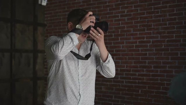 Photographer shoots on his camera