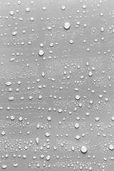 Surface with water drops, grey background