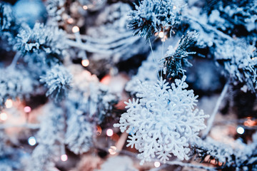 New Year's Toys xmas. Decorated Christmas tree on blurred, bokeh background