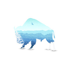 Silhouette of bizon with mountains  landscape and coniferous trees. Blue shades. Winter. Cold. Snowing. © yik2007