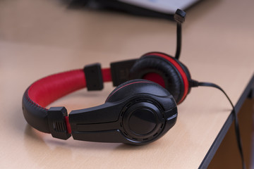 red-black headphones with a microphone