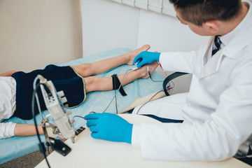 Patient nerves testing using electromyography. EMG