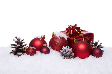 Christmas background with red balls on snow. Isolated on white