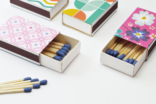 decorated matchboxes on white background