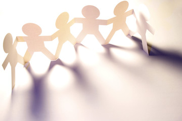 Paper chain team united in a row