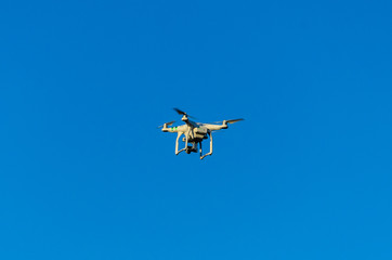 White drone in blue sky