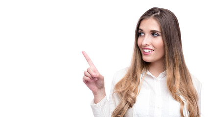 Happy beautiful businesswoman pointing on something isolated on white background