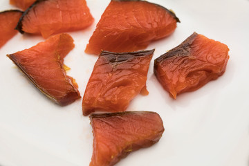 pieces of red fish on a plate