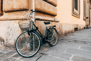 vintage bicycle standing at wall