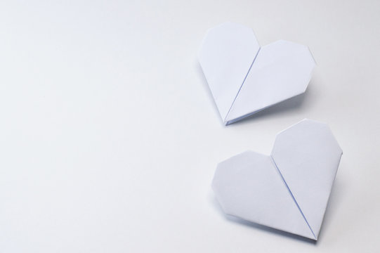 origami hearts on white background
