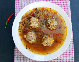 Soup with meat balls and vegetables on the table