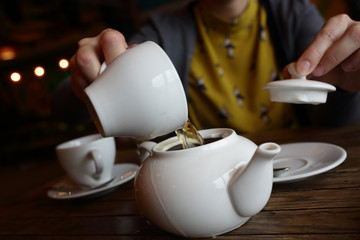 Person pouring green tea