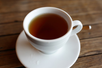 White cup with black of tea