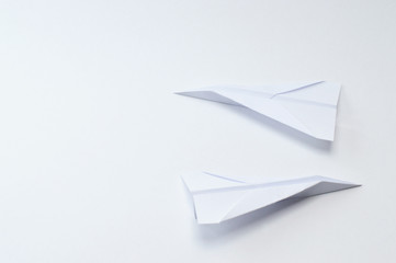 origami planes on white background