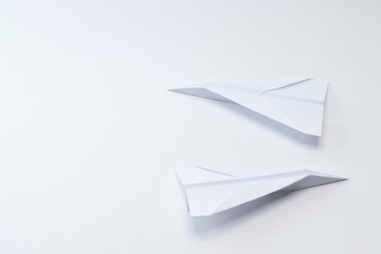 origami planes on white background