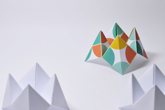three origami fortune tellers on white background