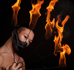 asian man with fire show