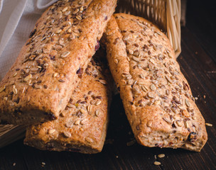 Healthy bread in a bucket. Homemade whole grain fitness bread sprinkled with seeds.