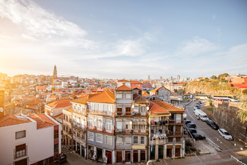 Fototapeta na wymiar CItyscape view with beautiful old buildings during the sunset light in Porto city, Portugal