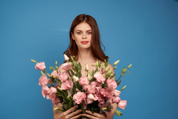 girl with two bouquets on a blue background