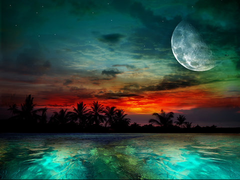 The ocean, sunset and moon
