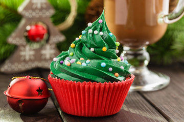 Green christmas cupcake in red cup