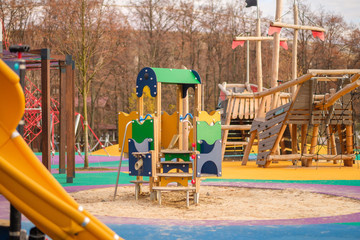 Modern equipped kids playground in sunny day. Crawl construction