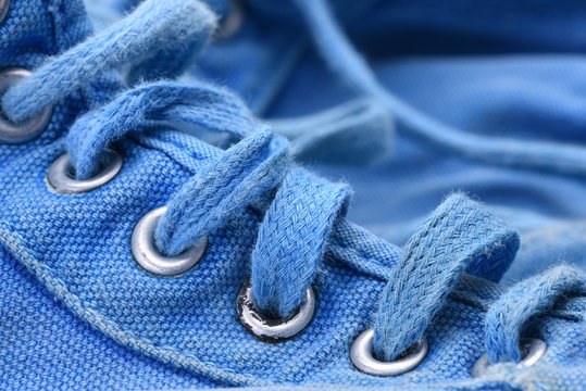 Old blue sneakers close-up
