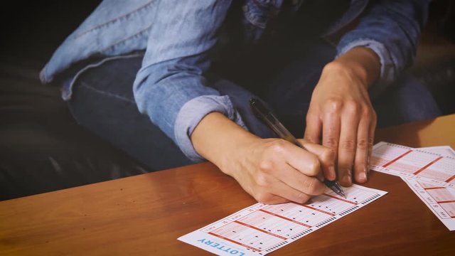Woman playing the lottery.