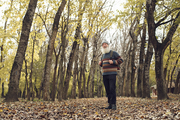 old man with beard in forest