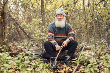old man with beard in forest