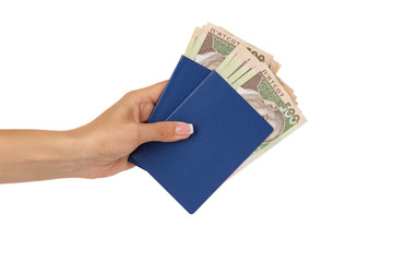 Woman’s hand holds passports with banknotes of five hundred hryvnias, isolated