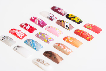 A set of artificial nails. Women's manicure. Nails on a white background. Photos for nail booklet.