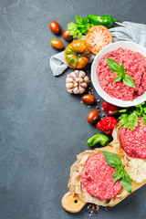 Homemade raw organic minced beef meat burger cutlet and vegetables