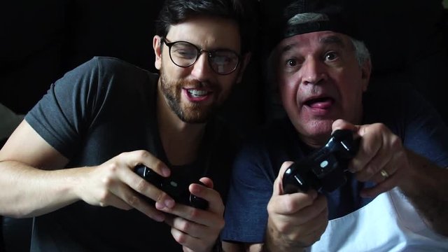 Father and Son Playing Videogame