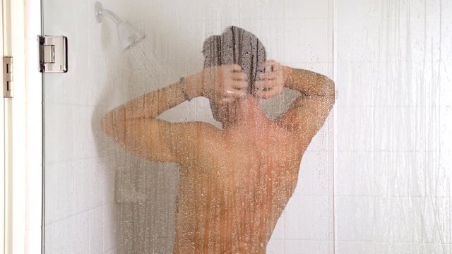 Athletic man in the shower.